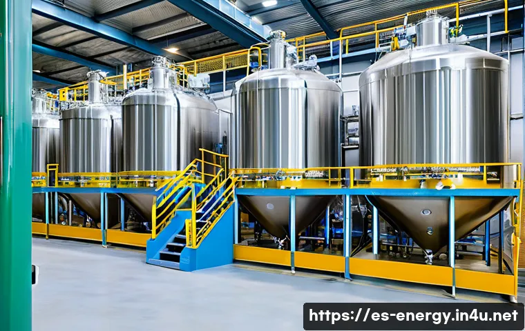 바이오 디젤 생산 공정 - A detailed industrial biodiesel production facility in Spain, showcasing large stainless steel react...